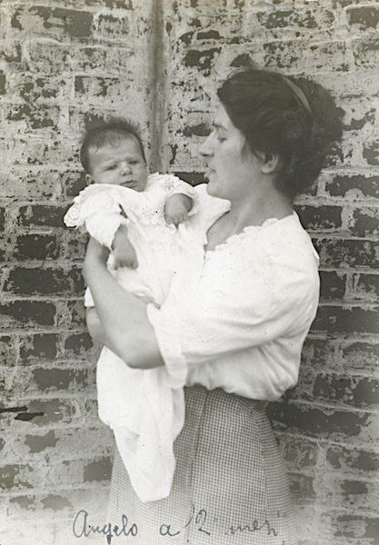Paolina holding her son outside their home, -Bronx, NY, September 1914, -Archive of the Tasca Estate